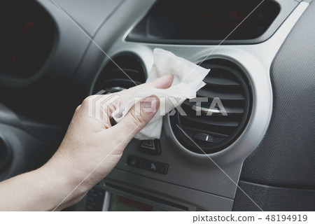 Cleaning car interior with cloth 48194919