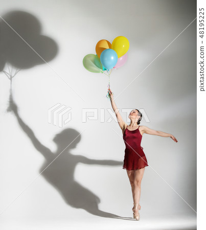 Ballet dancer posing with ballons Ballet dancer posing with ballons 48195225