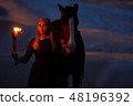 girl with fire and horse at night. Rococo era romance 48196392