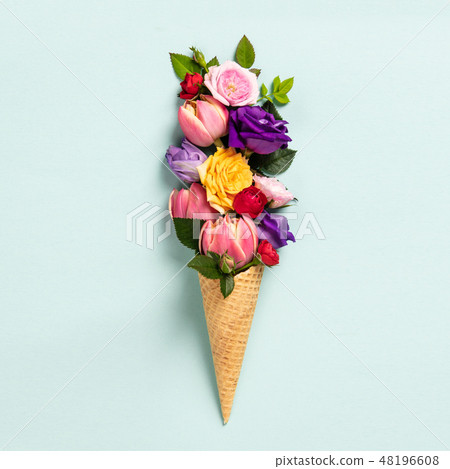 Ice cream cone with flowers and leaves. Summer minimal concept. Ice cream cone with flowers and leaves. Summer minimal concept. 48196608