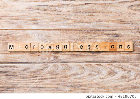 Microaggressions word written on wood block. Microaggressions word written on wood block. 48196705