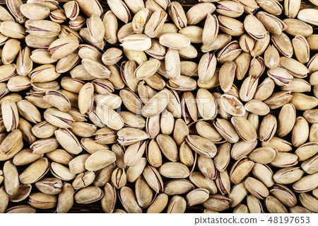 tasty pistachios lying on the table tasty pistachios lying on the table 48197653