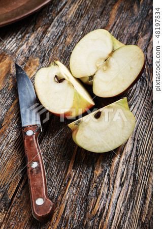 sliced apple on a wooden board. summer harvest sliced apple on a wooden board. summer harvest 48197834