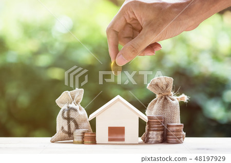 Saving money, home loan, mortgage, a property. Saving money, home loan, mortgage, a property. 48197929