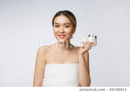 Beautiful Asia woman presenting product isolated on white background. COPY SPACE. 48198651