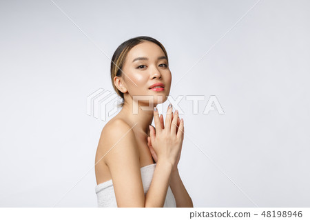 Sided portrait of Asian beautiful smiling girl with short hair showing her healthy skin on the 48198946