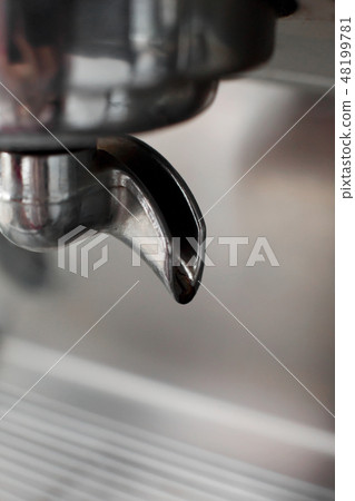 coffee machine close up of the holder of which a coffee machine close up of the holder of which a 48199781