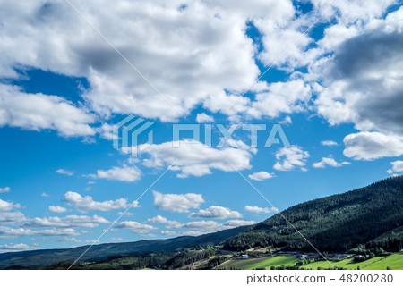 A dramatic cloudscapeover rural mountain hills A dramatic cloudscapeover rural mountain hills 48200280