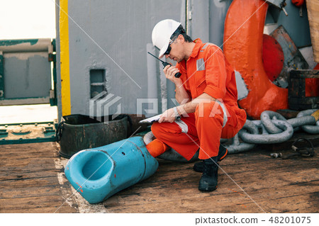 chief officer on deck of ship or vessel with checklist 48201075