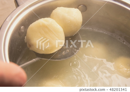 Cooking Plum Dumplings 48201341