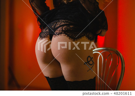 Sexy buttocks in black underwear and black stockings 48201611