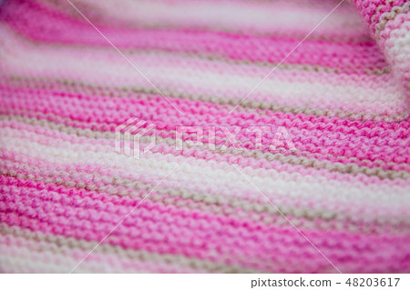 Pink, white and light brown striped knitted texture background 48203617