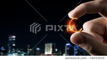 Money symbol between fingers 48203650