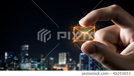 Email symbol between fingers Email symbol between fingers 48203651