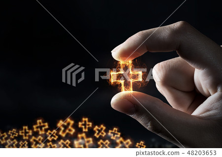 Cross symbol between fingers 48203653