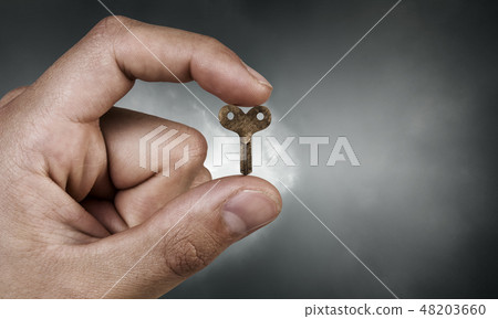 Key between fingers Key between fingers 48203660
