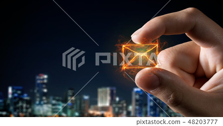 Email symbol between fingers Email symbol between fingers 48203777