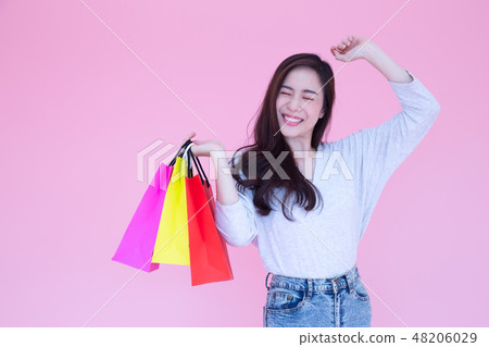 Happy Asian women enjoy shopping and holding bag Happy Asian women enjoy shopping and holding bag 48206029