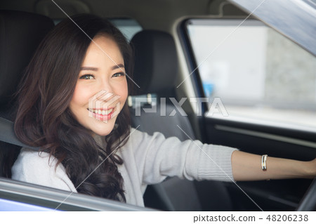 Asian women driving car and smile happy to travel 48206238