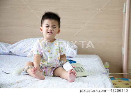 Asian baby boy smiling and wear patients suits Asian baby boy smiling and wear patients suits 48206540