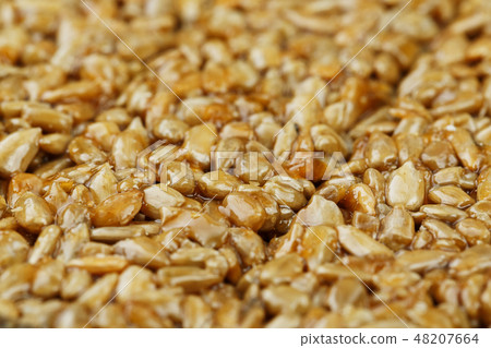 Kozinaki from golden, roasted sunflower seeds as 48207664