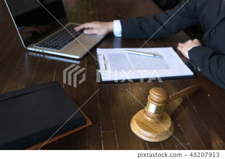 Lawyer working on the table . consultant lawyer 48207913