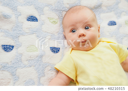 portrait of a little boy: baby's face close-up 48210315