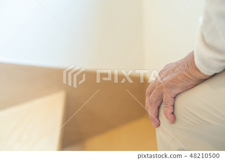 Senior female elderly old man going up stairs Senior female elderly old man going up stairs 48210500
