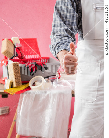 House painter in the construction site. House painter in the construction site. 48211159