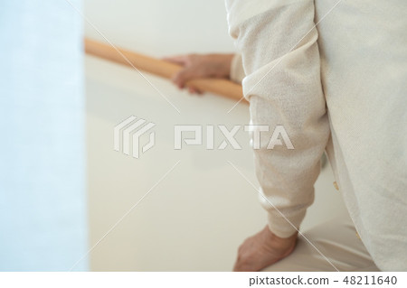 Senior female elderly old man going up stairs Senior female elderly old man going up stairs 48211640