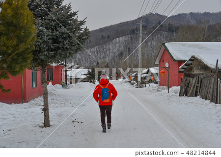 People walking on street of mountain town People walking on street of mountain town 48214844