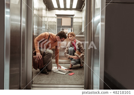 Blonde-haired wife feeling thankful while her man helping her 48218101