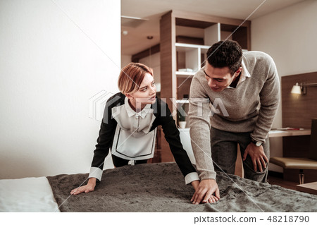 Hotel maid feeling discriminated while client touching her hand 48218790