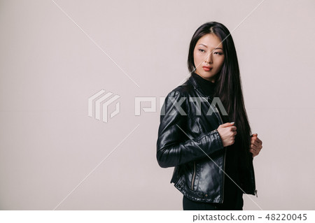 asian model in black jacket posing in studio asian model in black jacket posing in studio 48220045