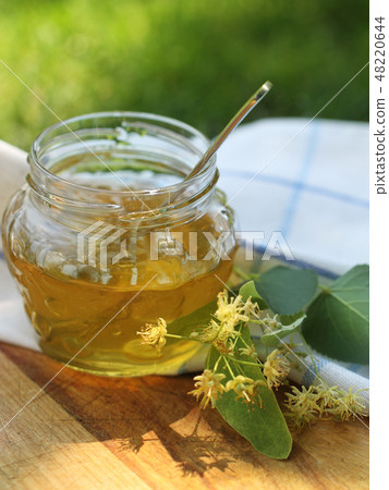 Linden honey with linden flowers 48220644