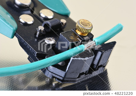 Electric tool wire stripper with cable close up 48221220