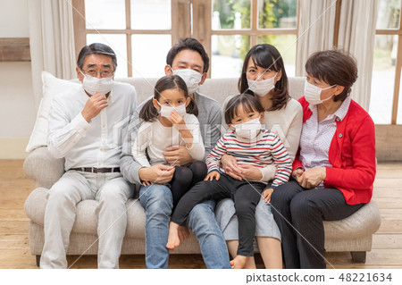 Three generations family wearing a mask with influenza Sneezing runny nose virus Cold cold prophylaxis 48221634