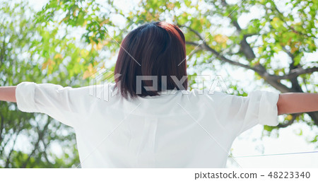 young woman feel carefree 48223340