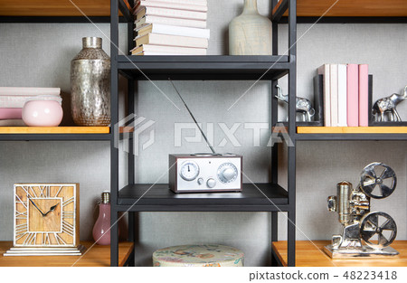 Compact radio on the shelf in the vintage interior of the living room Compact radio on the shelf in the vintage interior of the living room 48223418