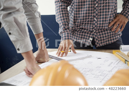 Architects discussing work Architects discussing work 48223660