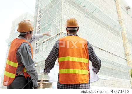 Contractors discussing work Contractors discussing work 48223710