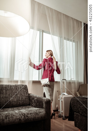Stylish businesswoman studying hotel room having business trip 48225005