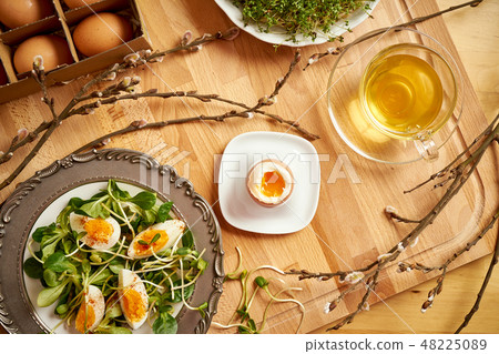 Spring and Easter breakfast with eggs and cress sprouts with tea and sprouts on wooden background 48225089