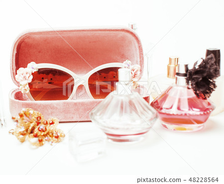 Jewelry table with lot of girl stuff on it, little mess in cosmetic brushes, women interior concept Jewelry table with lot of girl stuff on it, little mess in cosmetic brushes, women interior concept 48228564