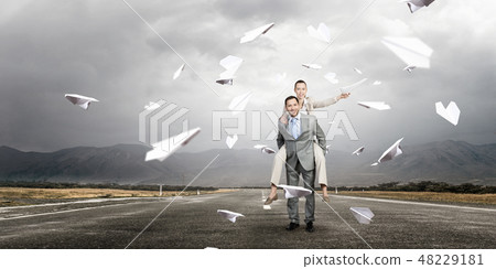 Business people having break in office Business people having break in office 48229181