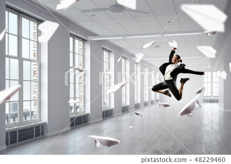 Dancing businesswoman in office 48229460