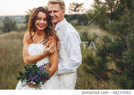 Beautiful wedding couple in a summer field 48231682