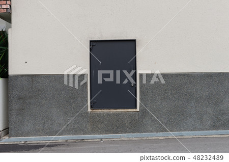 sidewalk by street wall & door sidewalk by street wall & door 48232489