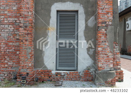 sidewalk by street wall & door sidewalk by street wall & door 48233102