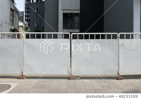 sidewalk by street wall & door sidewalk by street wall & door 48233109